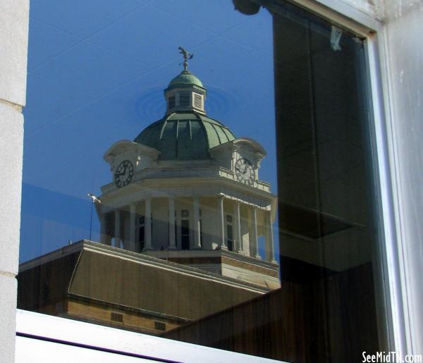 Courthouse reflection in window