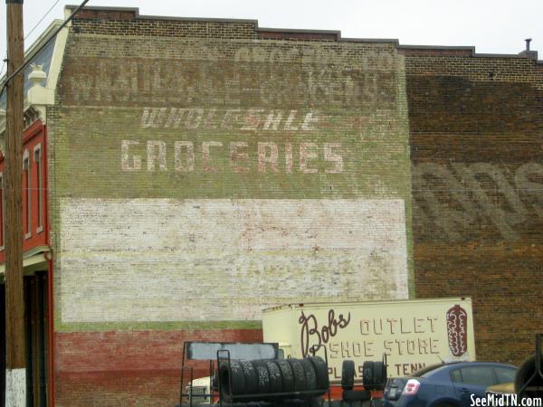 Wholesale Groceries faded wall ad