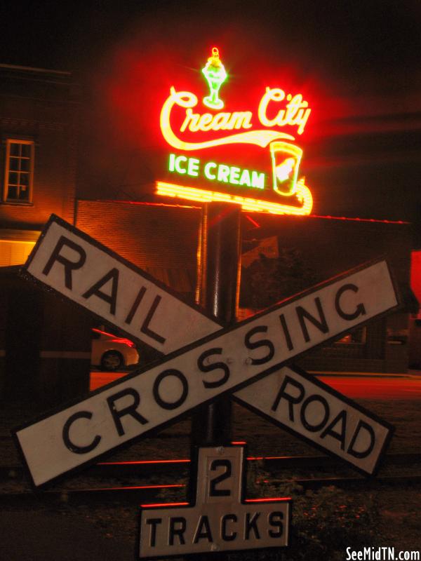Railroad Crossing & Cream City sign