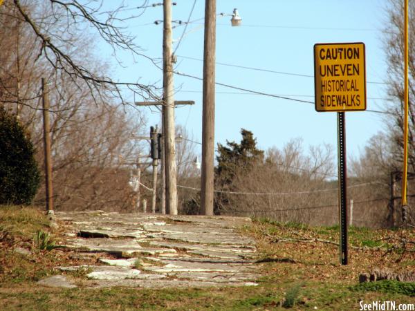 Caution Uneven Historical Sidewalks
