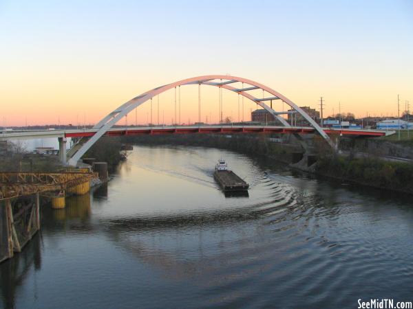 Korean Veterans Bridge at dusk with barge
