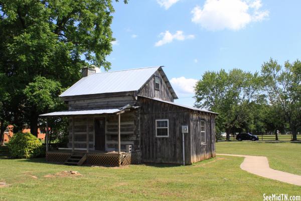 Log house along Hicks St.