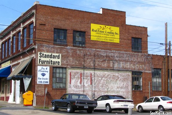 Coca-Cola and Ford faded murals