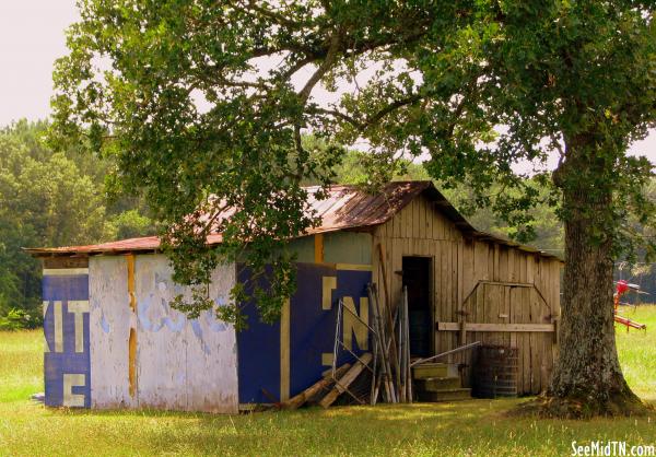 Barn held together by a billboard