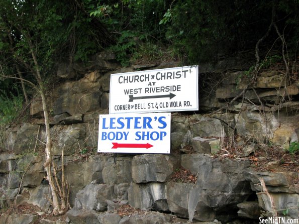 Signs on a rock bluff in McMinnville