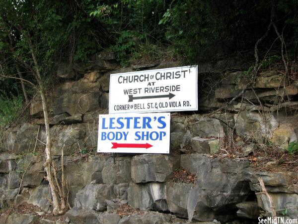 Signs on a rock bluff in McMinnville