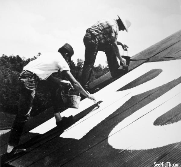 Painting a barn