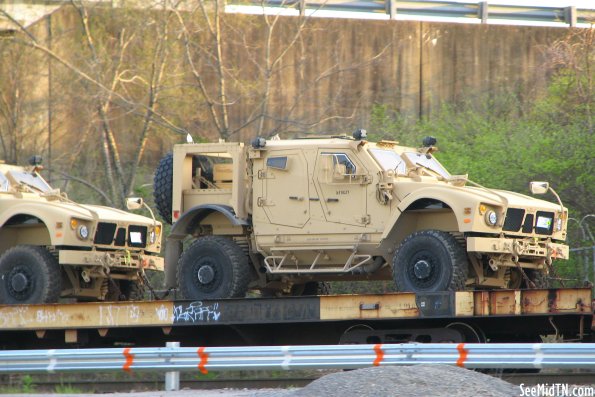 Train Flatbed car carrying military vehicles