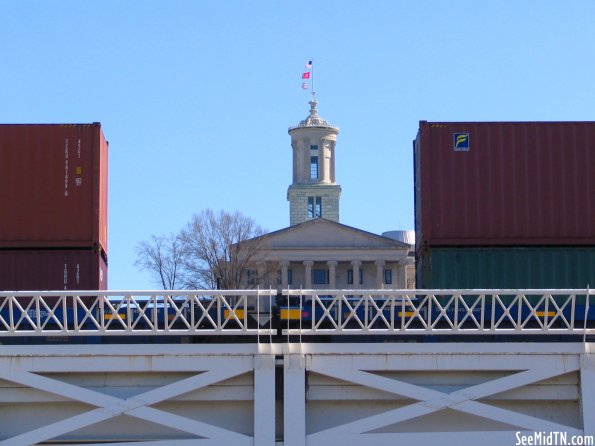 State Capitol between train cars