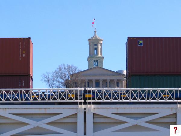 State Capitol between train cars