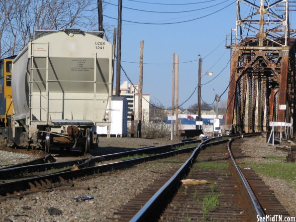 Behind a train