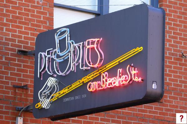 People on Beale St. neon sign